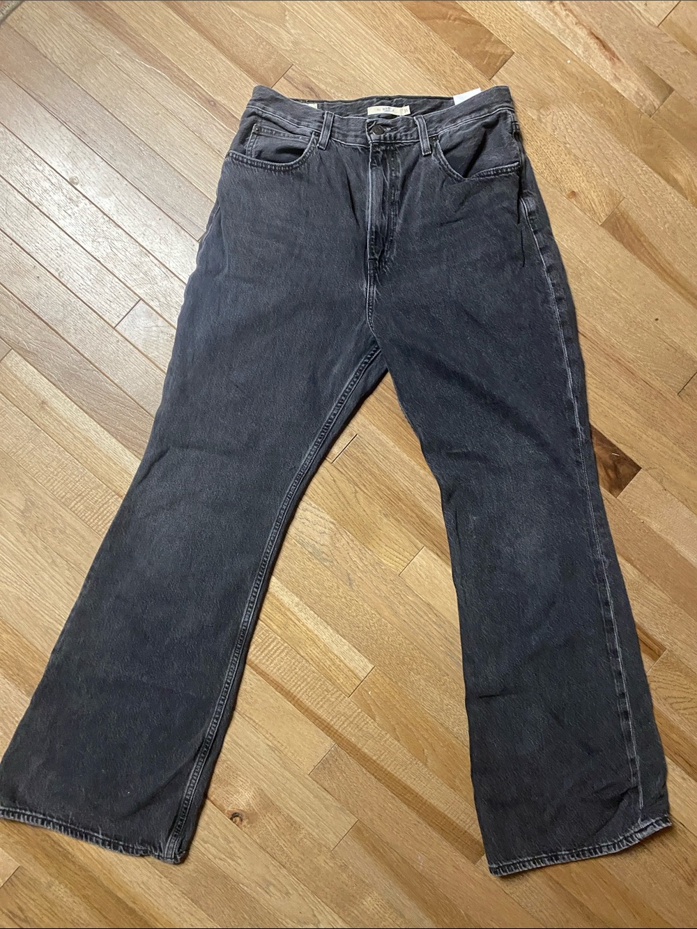 black denim Levi's jeans in a faded wash 70 high rise flare 31 waist